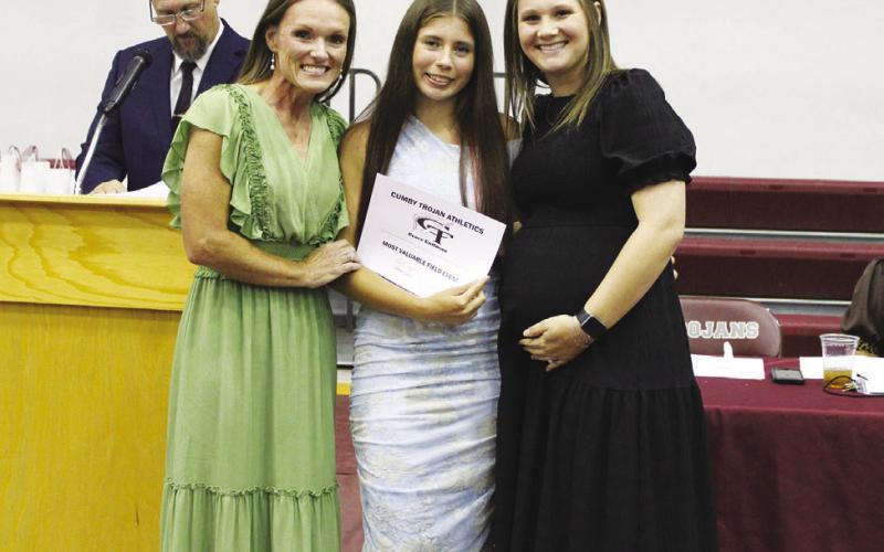 Grace Coffman (middle) was named Field Events MVP for girls track and field at the Cumby Collegiate Athletic Banquet Tuesday. Coaches Katie Emeyabbi (left) and Macy Knickerbocker presented the award.