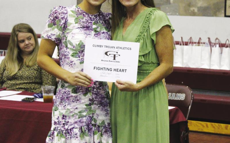 Brynn Emeyabbi (left) receieved the Female Fighting Heart Award at the Cumby Collegiate Athletic Banquet Tuesday. Her mother, Coach Katie Emeyabbi, presented the award. Brynn also receieved the Volleyball MVP Award.