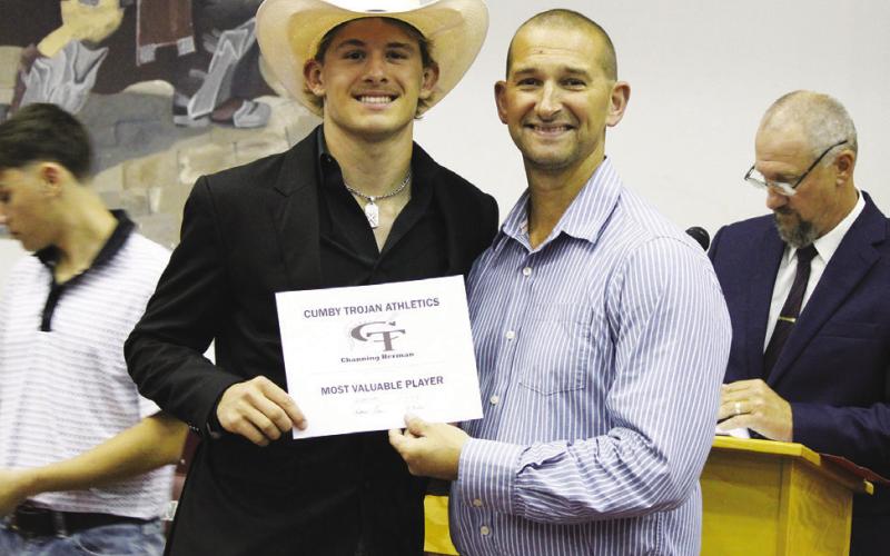 Channing Herman (left) received the Boys Golf MVP Award at the Cumby Collegiate Athletic Banquet Tuesday. Coach Micah Murphy presented the award. Staff Photos by DJ Spencer