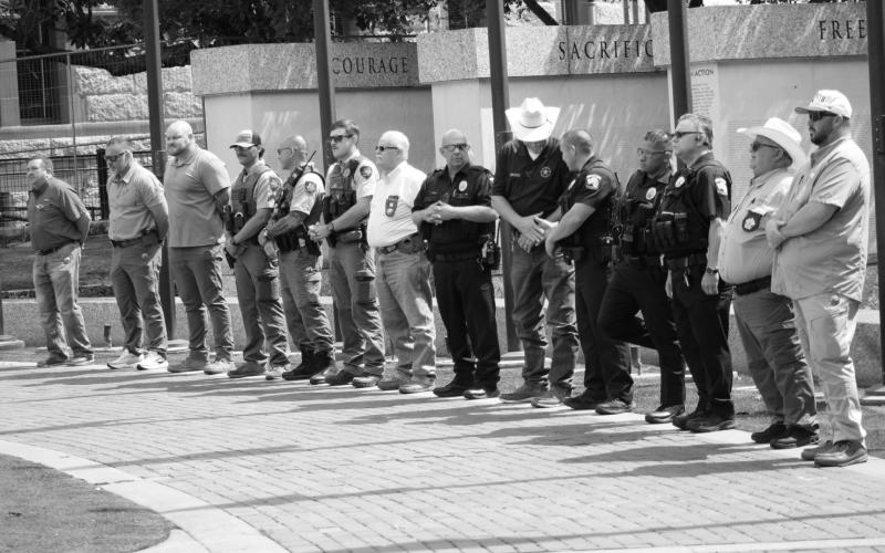 Hopkins County law enforcement officials line the walkway along the courthouse square during National Peace Officers Remembrance Day hosted May 15 by Hopkins County Marine Corps League.
