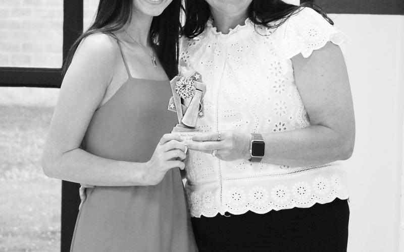 Mazie Ferrell (left) was named Cheerleader of the Year at North Hopkins' Athletic Banquet Monday. Presenting the award is Coach Kara Callihan.