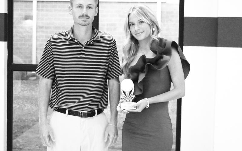 Eden Lewis (right) was recognized as a Regional Qualifier in golf at North Hopkins' Athletic Banquet Monday. Coach Evan Lewis presented the award.
