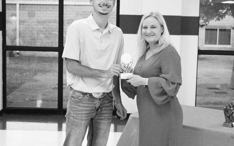 Jace Jordan (left) was recognized as a Regional Qualifier in golf at North Hopkins' Athletic Banquet Monday. Coach Danna Lewis presented the award.