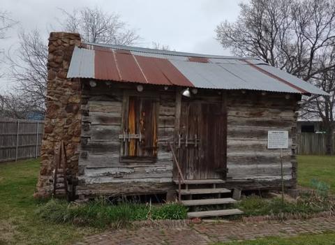 The Vaden Cabin now stands in the Hopkins County Heritage Park, but once housed slave owners in the Tira area of the county. Caroline Vaden, later Panell, was a child when she traveled from a slave market in Smith County, Tennessee, to a cotton plantation in Hopkins County, Texas. Her descendant, Corey sims, describes Caroline's well-documented story after locating the Vaden Cabin in 2025.