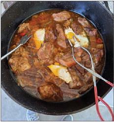 A pot of seasoned pork with eggs on top, and a corn and potato vegetable medley were among the dishes prepared.