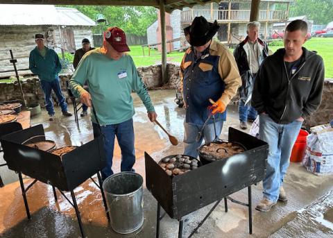 Rick Wilson explains how each coal delivers a certain amount of heat, and the number of them it takes to result in a 350-degree cooking time in a Dutch oven.