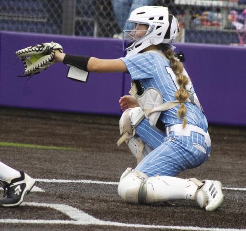 Presley Hunt (12) catches a pitch during the Como-Pickton's Regional Finals matchup against Woden Friday. Hunt batted 1/2, recorded an RBI and scored a run in Como-Pickton's 8-4 comeback victory.