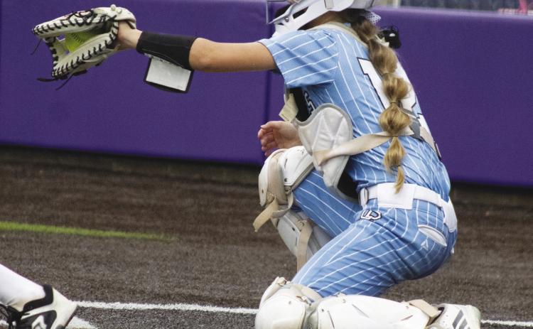 Presley Hunt (12) catches a pitch during the Como-Pickton's Regional Finals matchup against Woden Friday. Hunt batted 1/2, recorded an RBI and scored a run in Como-Pickton's 8-4 comeback victory.