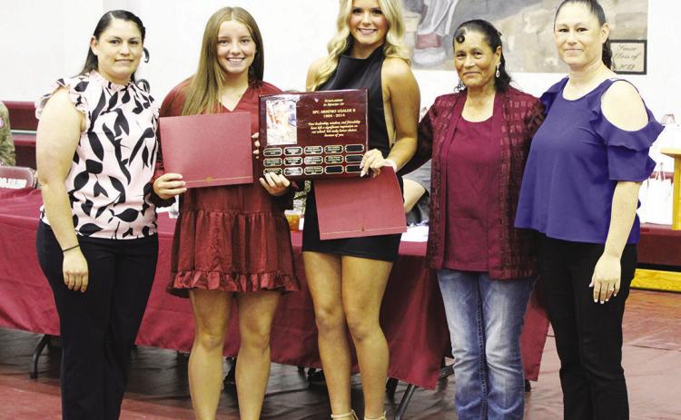 Kinslee Dowdle (second from left) and Ella Horne (middle) each received the Arsenio Ugalde Memorial Scholarship, worth $1,000. They are pictured with (from left) Mary Ugalde, Dula Ugalde and Juliana Osornio. See Page 2 for more photos. Staff photo by DJ Spencer