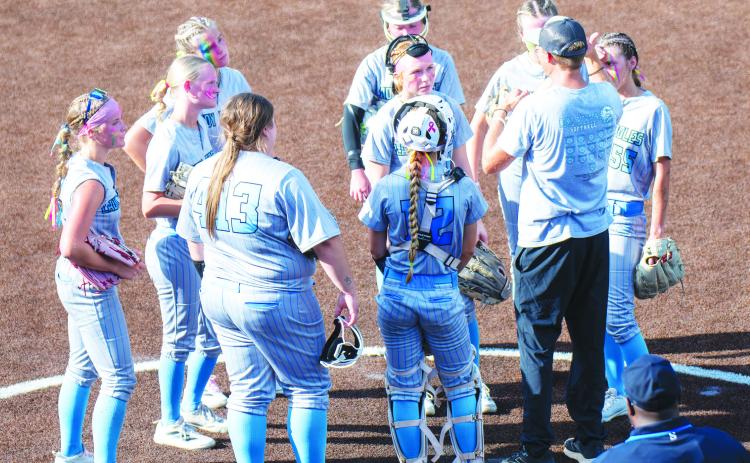 The Como-Pickton Lady Eagles listen to instructions from Head Coach Trevor Wallace during a circle visit in Game 1 of their Class 2A/D2 State Semifinals series against Shiner. The Lady Eagles split the first two games of the series, losing the first game 13-1 and winning the second game 4-2. Photos by Colton Foster, Sports Editor at The Huntsville Item